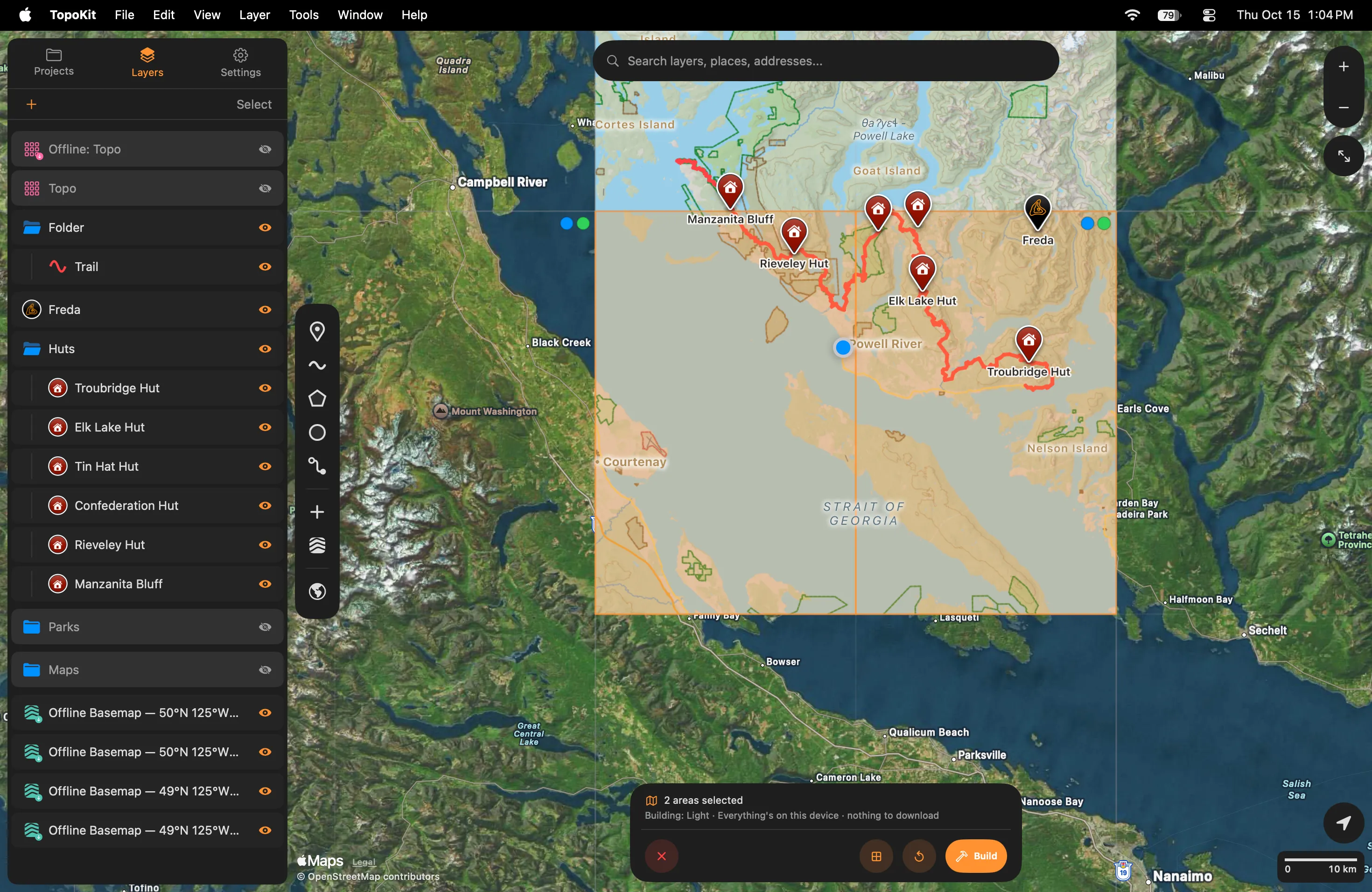 The area picker on Mac at full screen: two quarters picked in orange over the Sunshine Coast, the dots in the squares' corners, and the tool card reading 2 areas selected, Building: Light, nothing to download