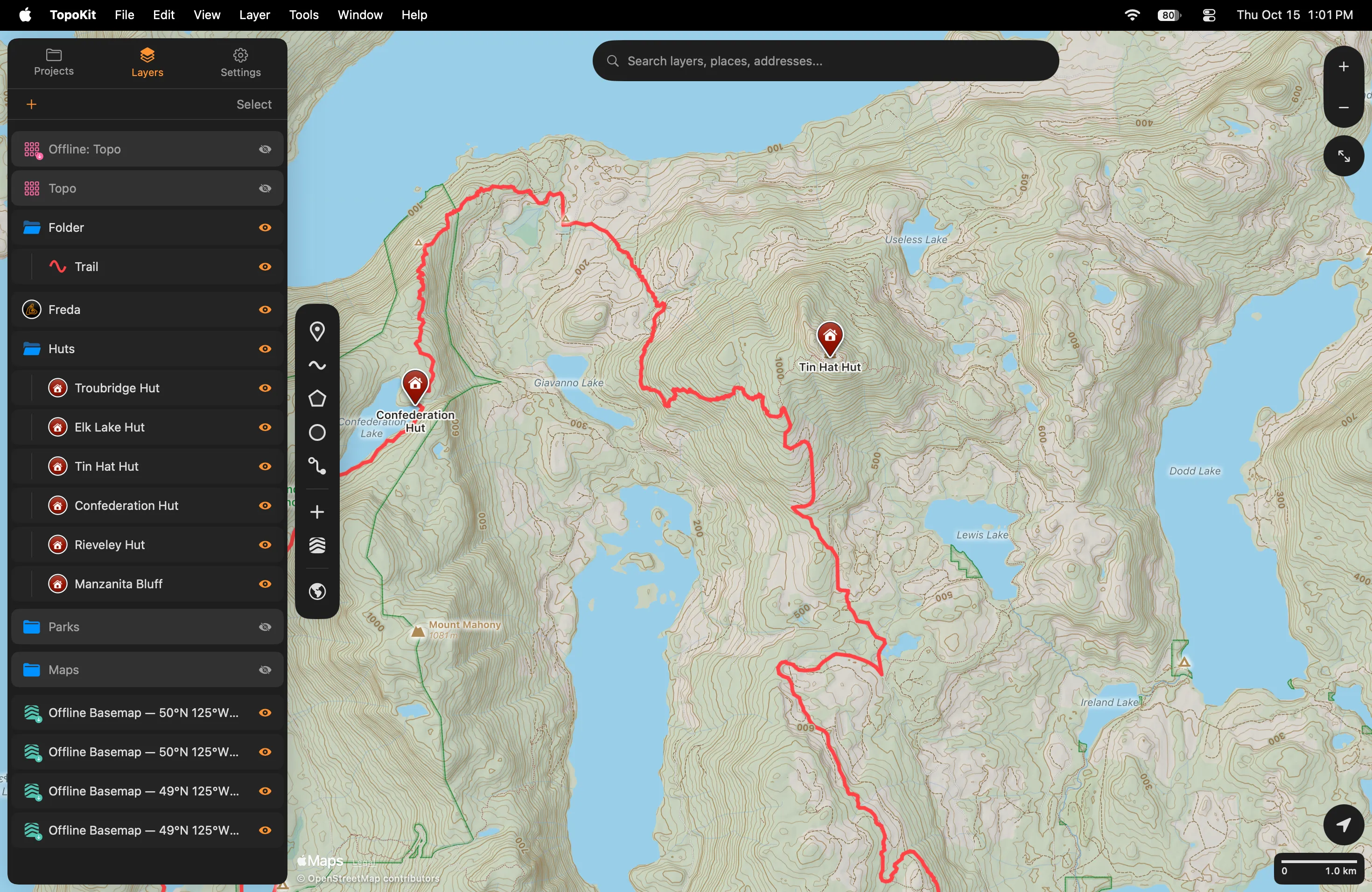 Four built basemaps around Tin Hat Hut on Mac, with their rows at the foot of the Layers tab, each a topo tile badged with a download arrow and named Offline Basemap with its square