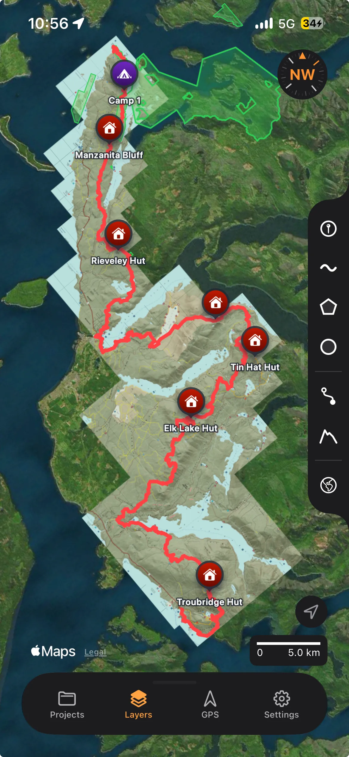 TopoKit on iPhone: full-screen map with the tool sidebar on the right edge and the bottom sheet at its slim height