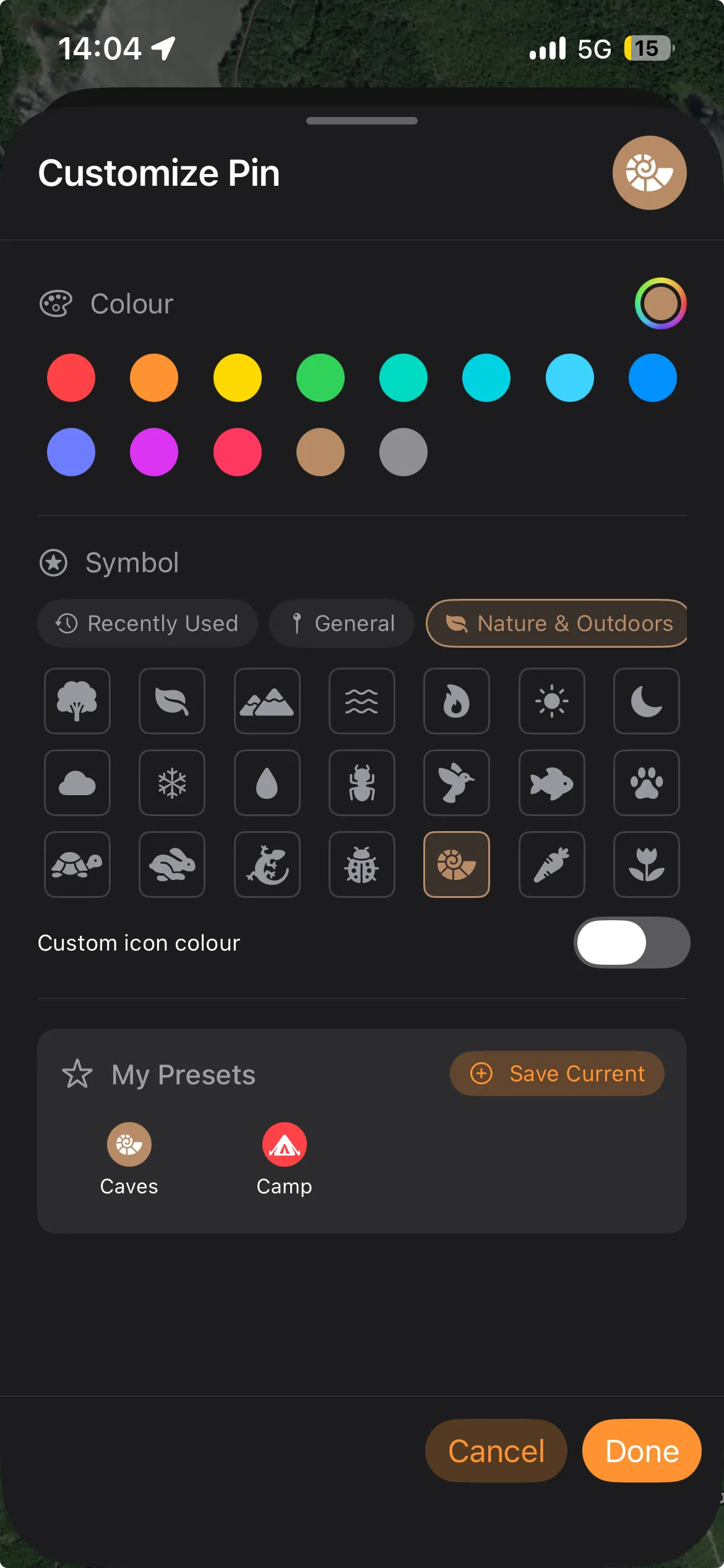 The pin customization sheet on iPhone with the glyph picker open, showing the category list, the glyph grid, the quick-pick colour swatches and the live pin preview
